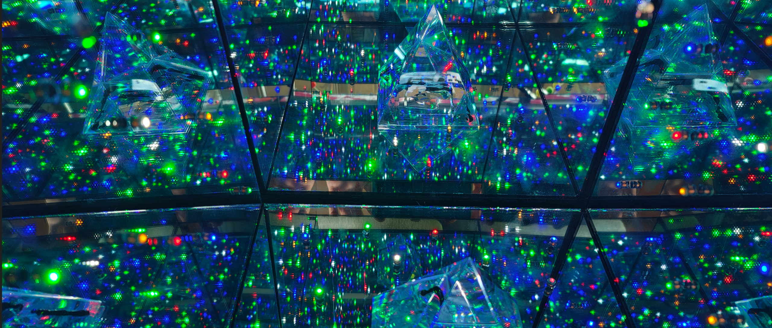 an infinity box showing lights and a triangular prism